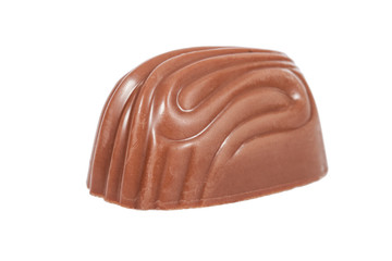 Gourmet bonbon, aka bon-bon or truffle made of milk chocolate. Closeup macro detail isolated on white background