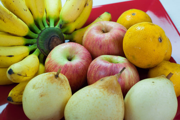 Naklejka na ściany i meble a variety of fresh fruit on white wood for billboards and background