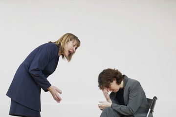 two business women arguing and crying