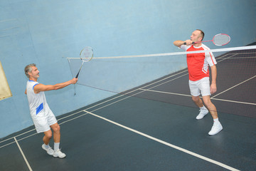 Fototapeta premium Men playing badminton