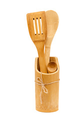 Set of wooden kitchen accessories on white background.