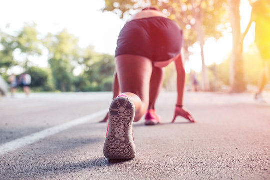 Woman Athlete In The Ready  Set  Go Position To Start Running