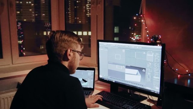 Young 3d designer is working on 3d model