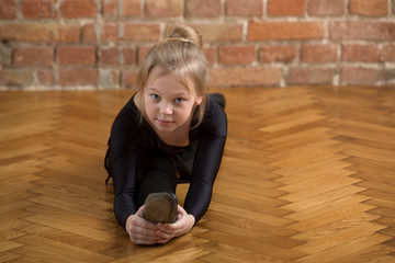 young girl dancer stretching
