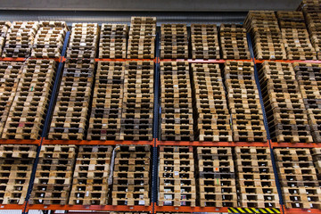 wooden cargo pallets storing at warehouse shelves