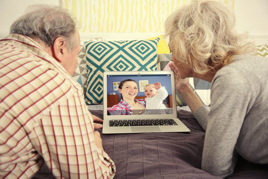 Video Call And Chat Concept. Senior People Video Conferencing On Laptop