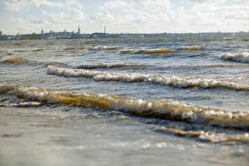 baltic sea waves and tallinn city outlines