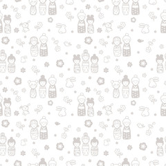 seamless background with kokeshi dolls on a white background