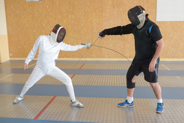 Fototapeta premium Two people in fencing competition