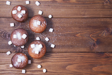 wooden background with muffins