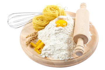Kitchenware, flour and egg on white background.