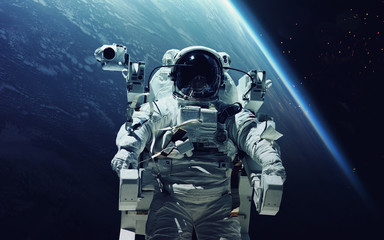 Astronaut at spacewalk. Cosmic art, science fiction wallpaper. Beauty of deep space. Billions of...