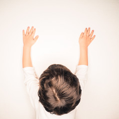 Closeup of beautiful brown hair on unrecognizable boy, stretchin