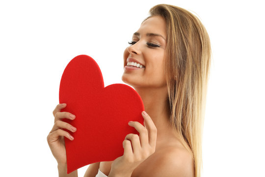 Beautiful woman posing with heart