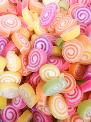 Fototapeta na wymiar Colorful Jelly Candy bonbon snack group. sweet for valentines day background. pastel color in green yellow pink purple orange.