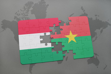 puzzle with the national flag of hungary and burkina faso on a world map