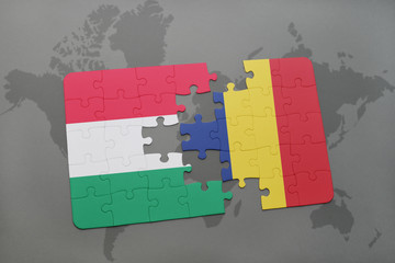 puzzle with the national flag of hungary and chad on a world map