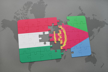 puzzle with the national flag of hungary and eritrea on a world map