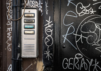 Door entry-phone with grafitti