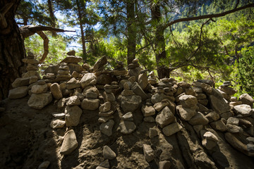 Samaria Gorge. Tourist tradition - a way of stones in the form of slides, in series or in the form...
