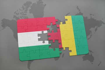 puzzle with the national flag of hungary and guinea on a world map
