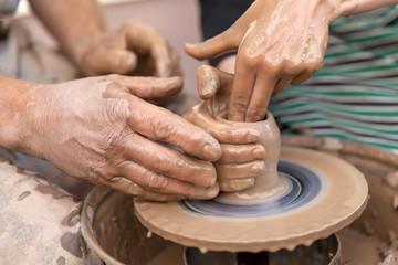 Pottery making, close up on hands