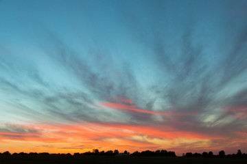 Dramatic sunset sky on countryside.