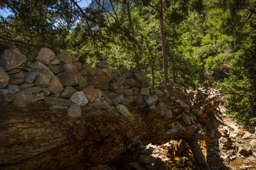 Samaria Gorge. Tourist tradition - a way of stones in the form of slides, in series or in the form of a pyramid. Island of Crete, Greece.
