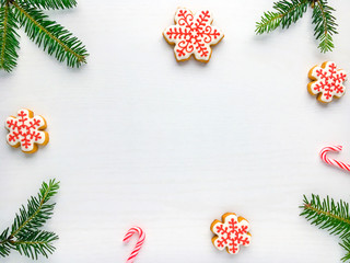 Christmas background with gingerbread cookies  and green fir tre