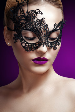 beautiful woman in a black mask. carnival mask Close-up female p