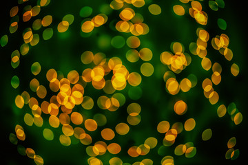 Bokeh background glowing oval shaped glow dark yellow green mixed empty