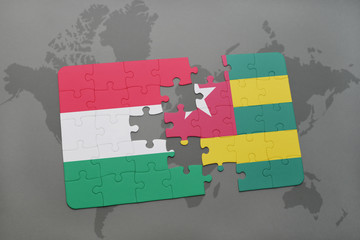 puzzle with the national flag of hungary and togo on a world map