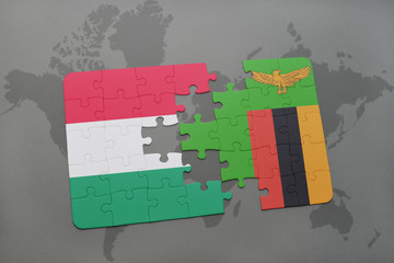 puzzle with the national flag of hungary and zambia on a world map