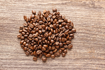 Coffee beans on wooden background