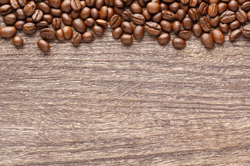 Coffee beans on wooden background
