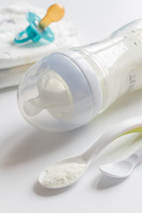 Fototapeta na wymiar preparation of mixture baby feeding on white background