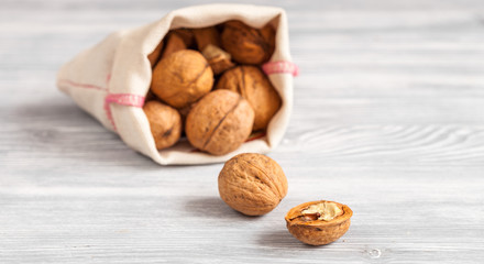 cosmetic and therapeutic walnut oil on wooden background