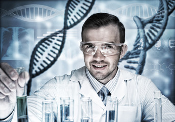 Young scientist mixing reagents in glass flask in clinical laboratory