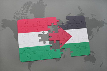 puzzle with the national flag of hungary and palestine on a world map