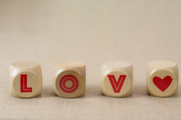 Wooden blocks LOVE for valentine background