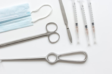 instruments for cosmetic surgery on white background top view