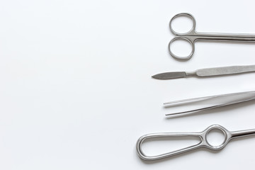 instruments for cosmetic surgery on white background top view