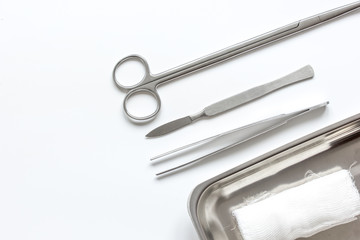 instruments for cosmetic surgery on white background top view