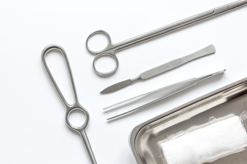 instruments for cosmetic surgery on white background top view
