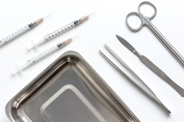 instruments for cosmetic surgery on white background top view