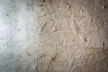 Old destroyed concrete wall with uneven structure