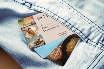 Holiday celebration concept. Spa service gift cards in pocket