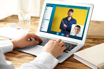 Man video conferencing on laptop. Online car service concept.