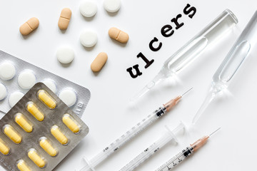 concept - ulcers top view on white background