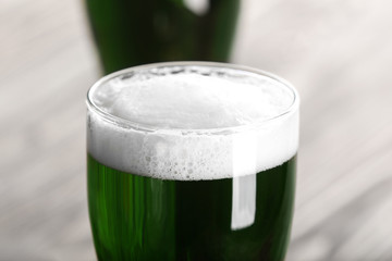 St. Patrick Day concept. Glass of green beer, closeup